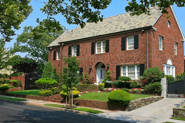 Elegant brick house with landscaped garden and driveway